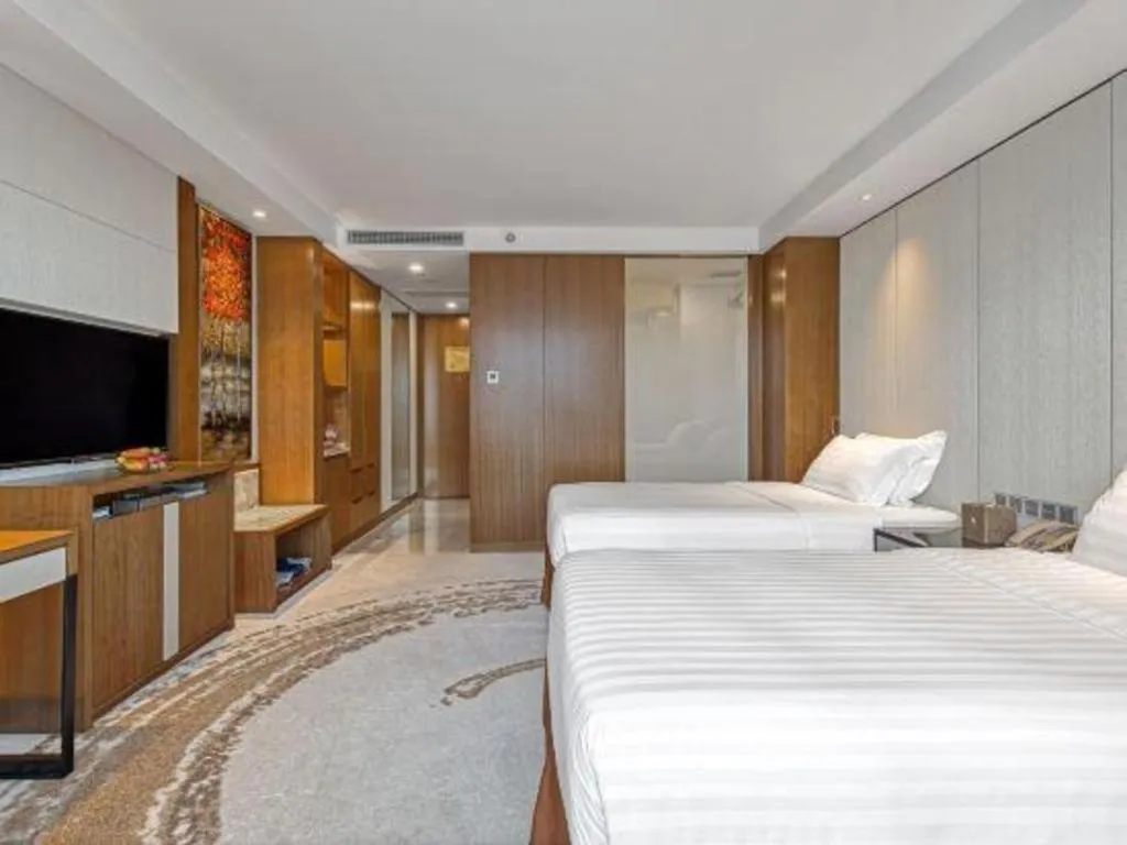 Bed in Hainan Junhua Haiyi Hotel