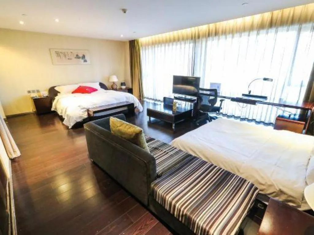 Bed in Hotel Kapok Wangfujing