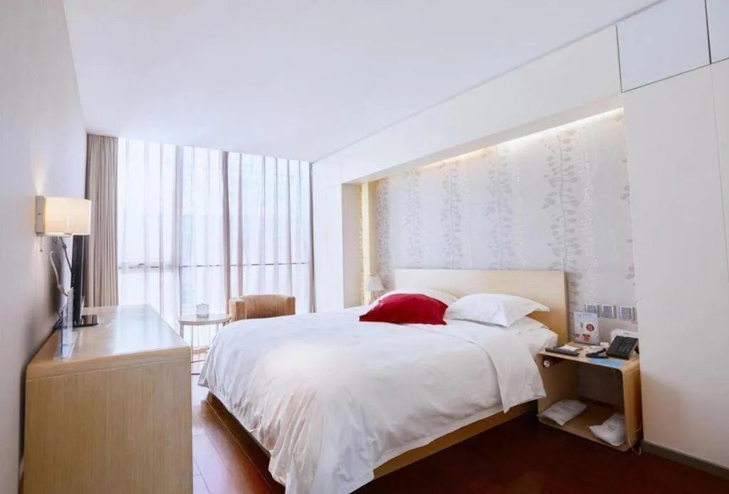 Bed in Hotel Kapok Wangfujing