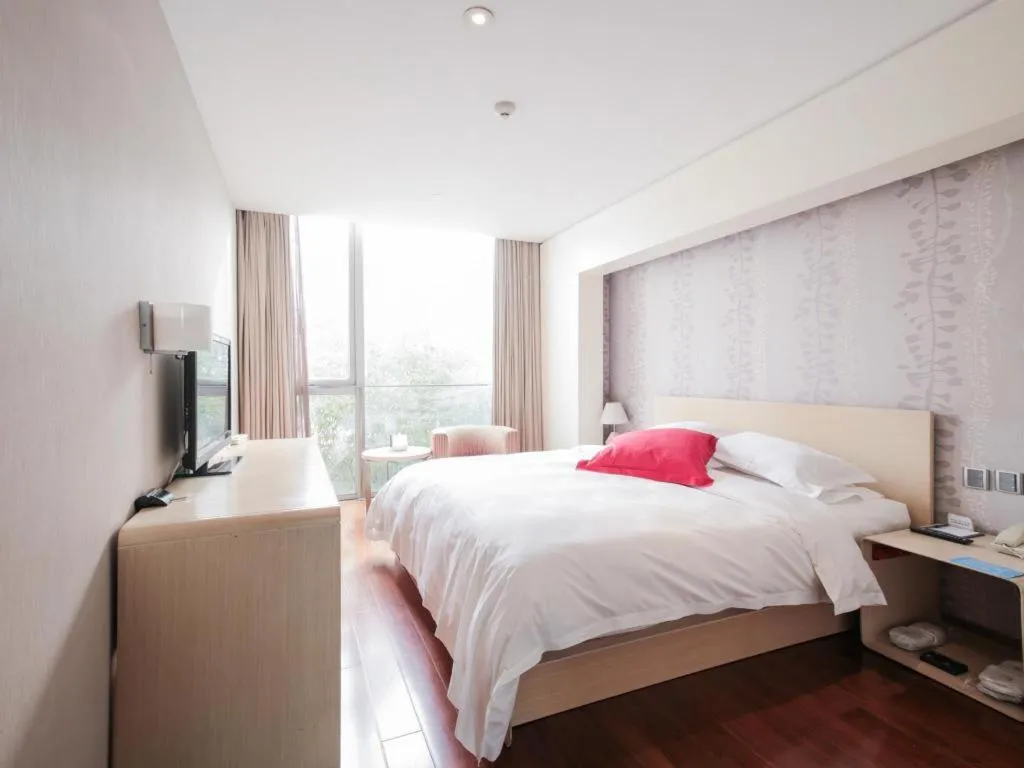 Bed in Hotel Kapok Wangfujing