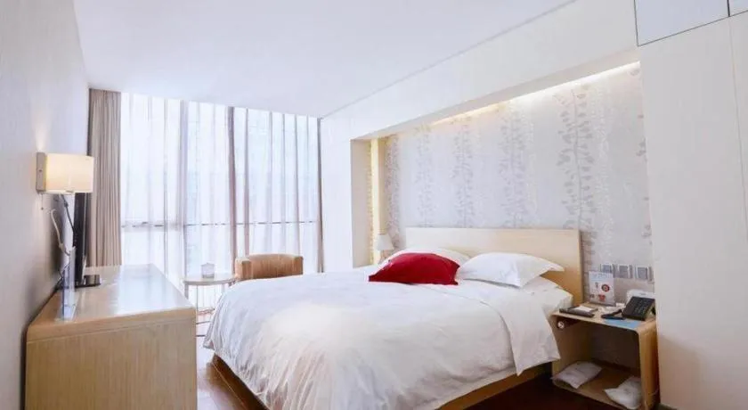 Bed in Hotel Kapok Wangfujing