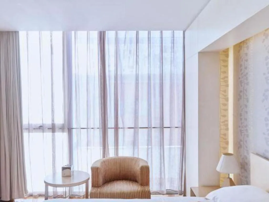 Bed in Hotel Kapok Wangfujing