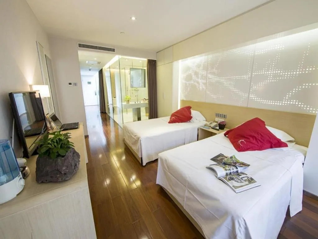 Bed in Hotel Kapok Wangfujing