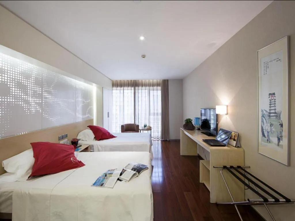 Bed in Hotel Kapok Wangfujing