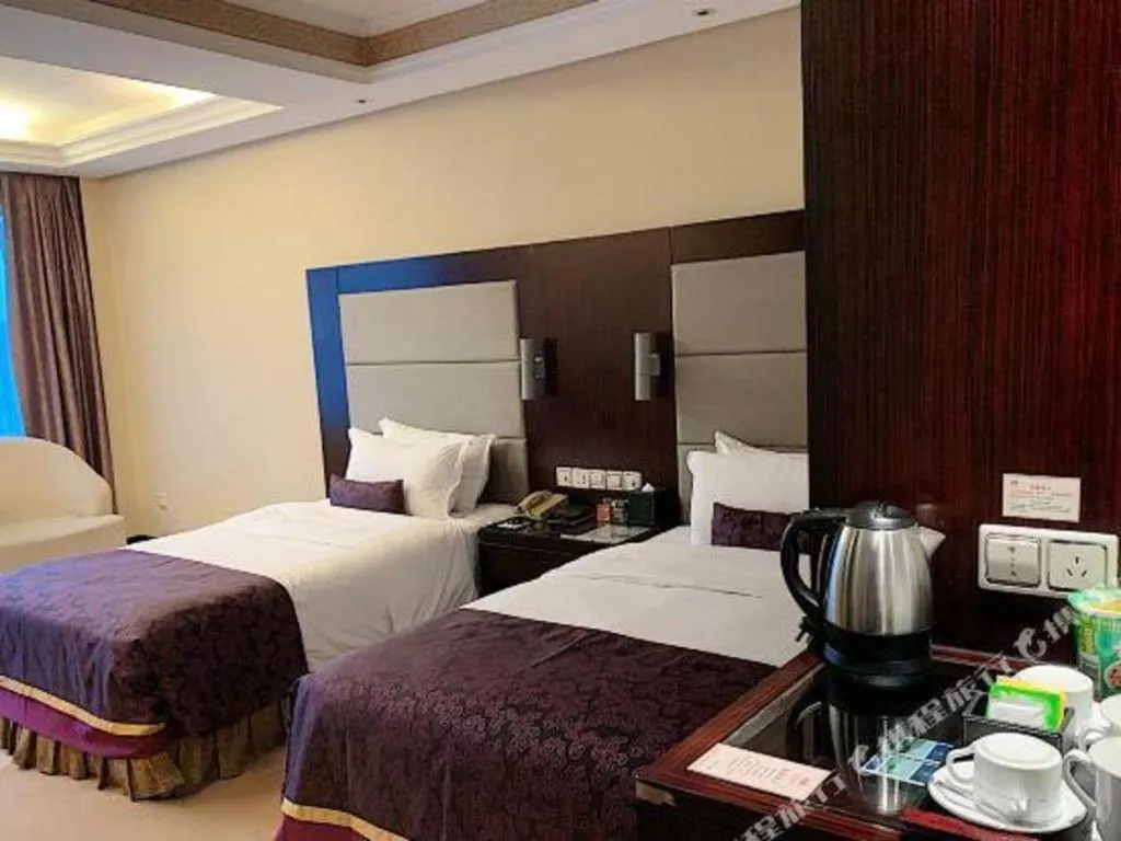 Bed in Yiwu Yimei Plaza Hotel