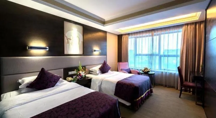 Bed in Yiwu Yimei Plaza Hotel