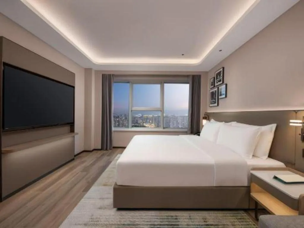 Bed in Yiwu Yimei Plaza Hotel