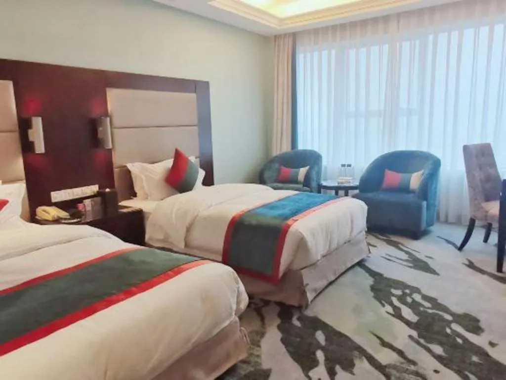 Bed in Yiwu Yimei Plaza Hotel