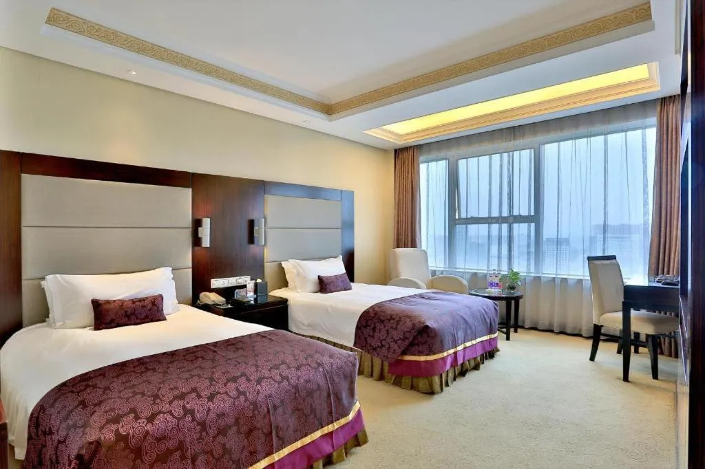 Bed in Yiwu Yimei Plaza Hotel