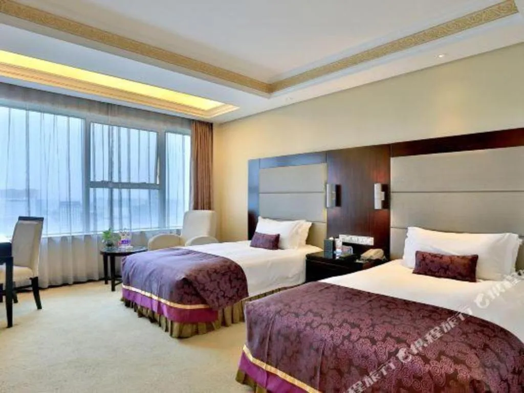 Bed in Yiwu Yimei Plaza Hotel