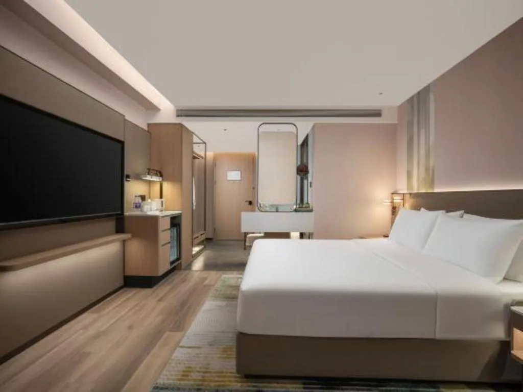 Bed in Yiwu Yimei Plaza Hotel