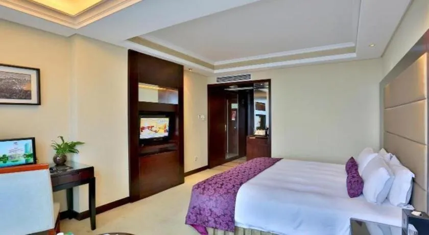 Bed in Yiwu Yimei Plaza Hotel