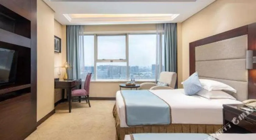 Bed in Yiwu Yimei Plaza Hotel