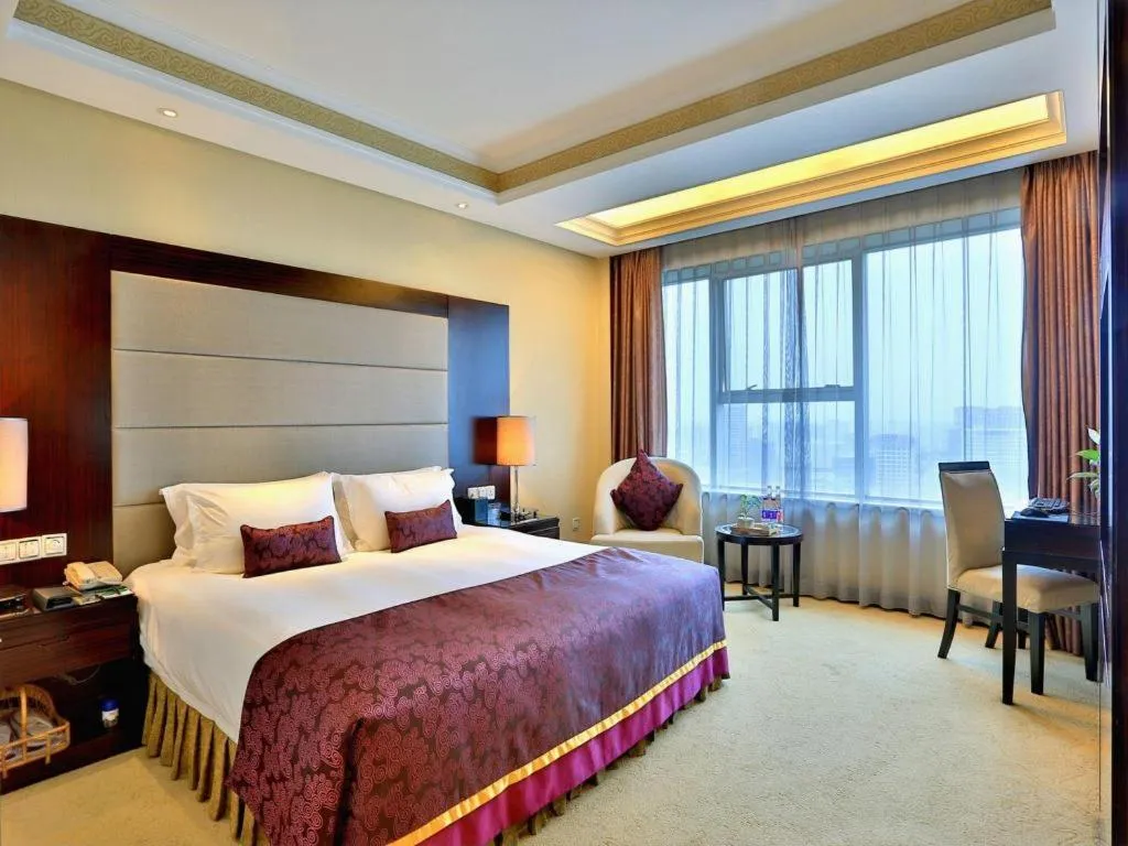 Bed in Yiwu Yimei Plaza Hotel