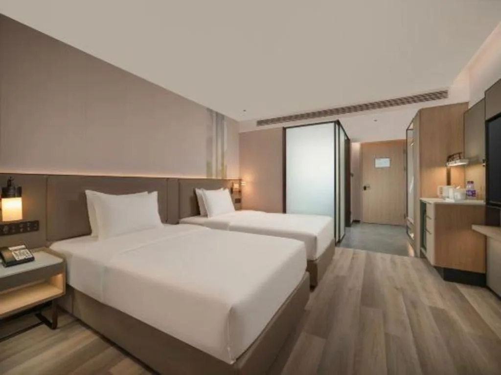 Bed in Yiwu Yimei Plaza Hotel