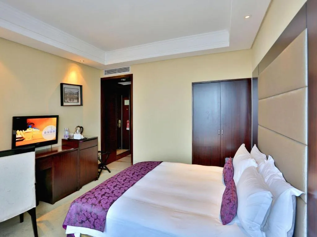 Bed in Yiwu Yimei Plaza Hotel