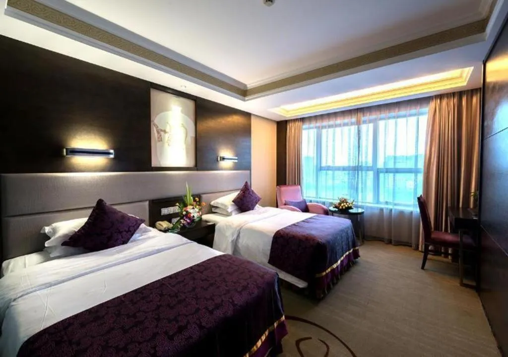 Bed in Yiwu Yimei Plaza Hotel