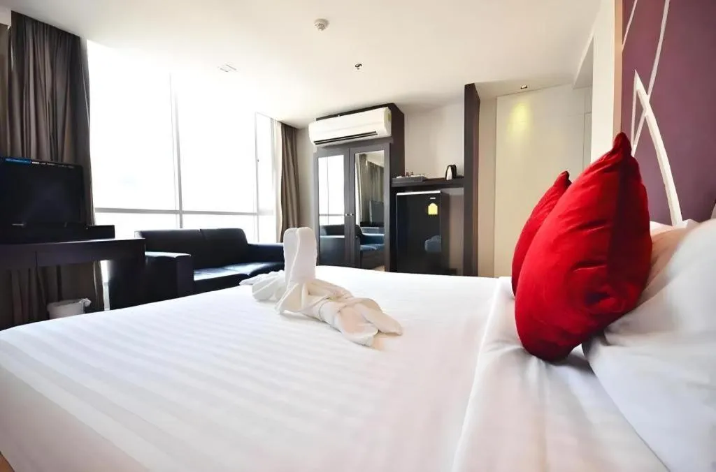 Bed in The Heritage Sathorn Suite Hotel