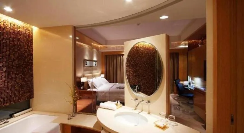 Bed in New World Wuhan Hotel