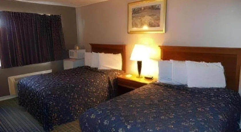 Bed in Days Inn by Wyndham West Branch Iowa City Area