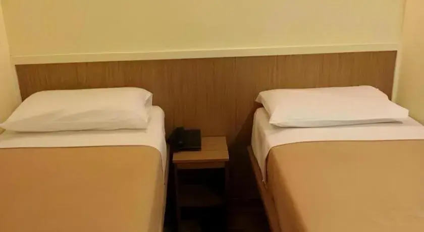 Bed in Arianna Hotel Bed in Arianna Hotel