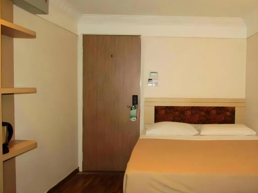 Bed in Arianna Hotel