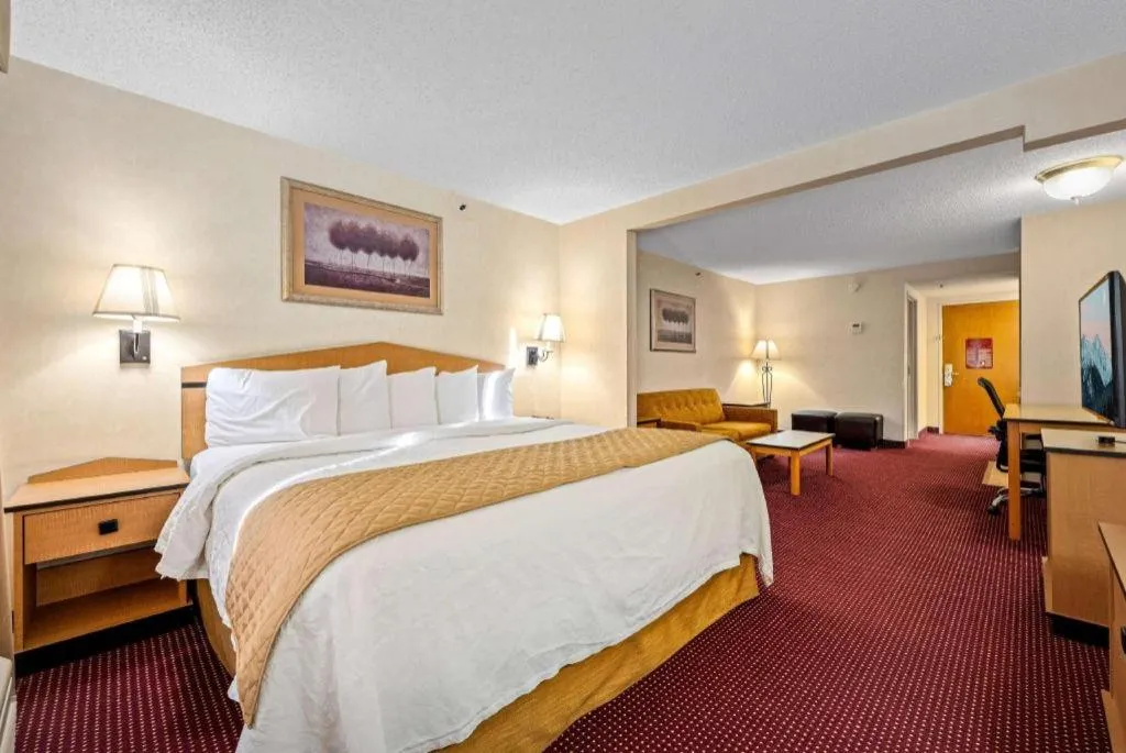 Bed in AmericInn by Wyndham Denver Airport