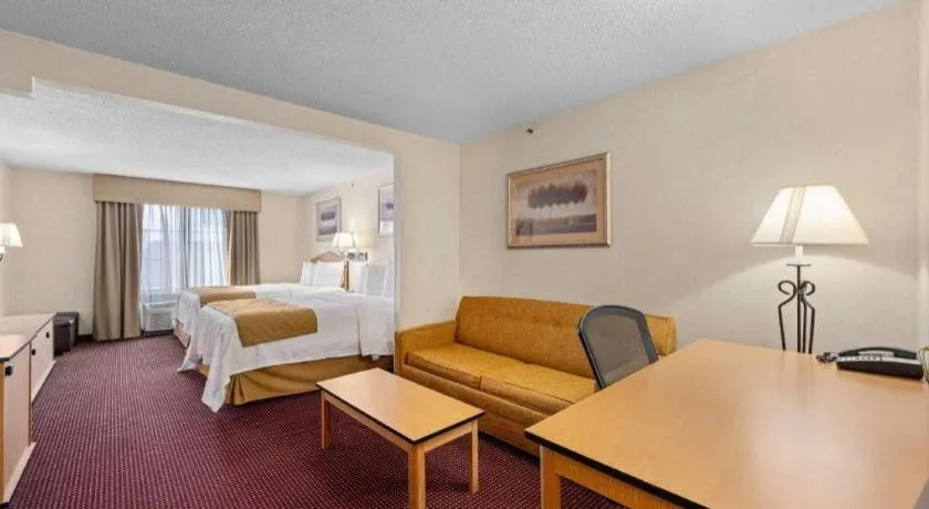 Bed in AmericInn by Wyndham Denver Airport