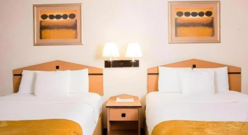 Bed in AmericInn by Wyndham Denver Airport