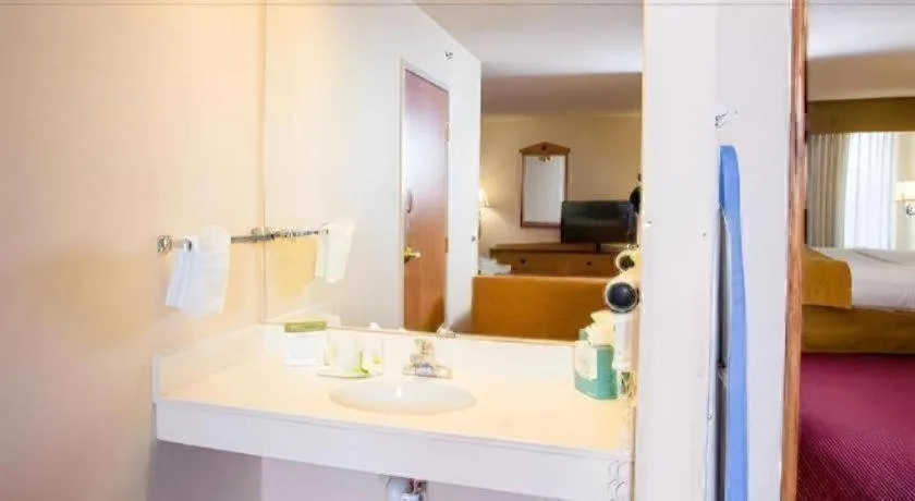 Bed in AmericInn by Wyndham Denver Airport