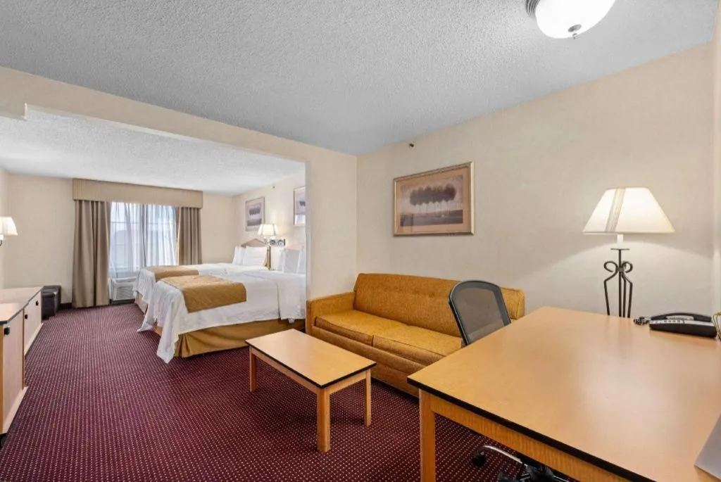 Bed in AmericInn by Wyndham Denver Airport