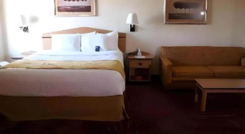 Bed in AmericInn by Wyndham Denver Airport