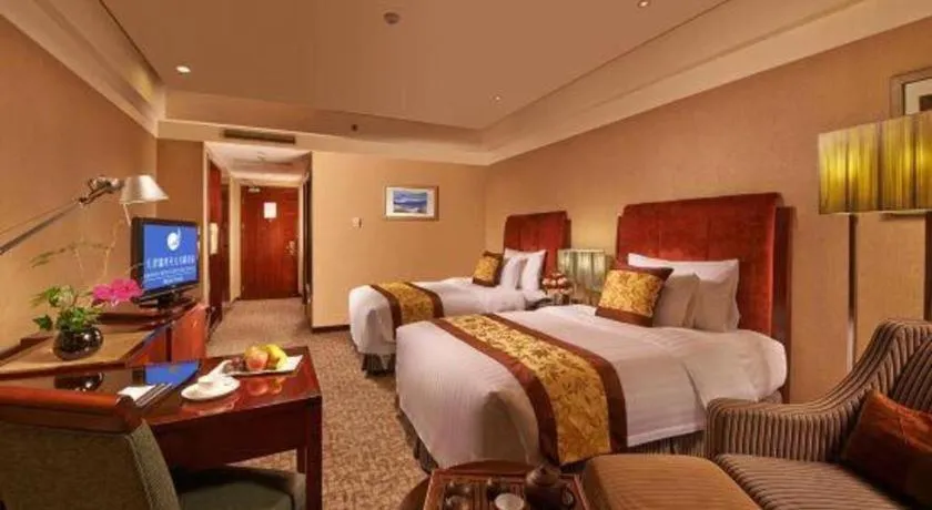 Bed in Grand New Century Hotel Binhai Tianjin