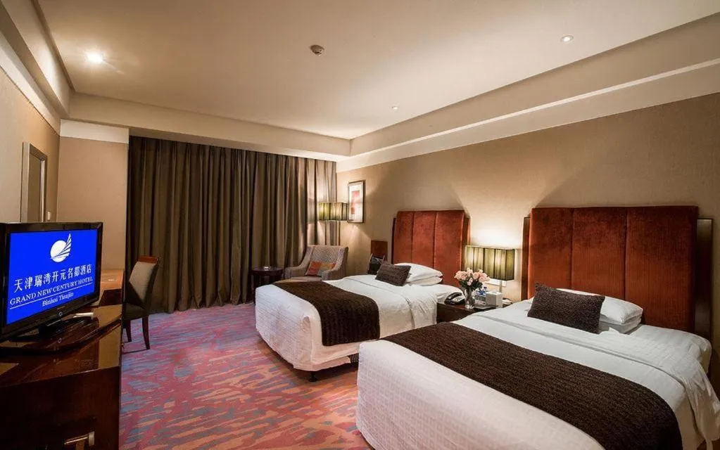 Bed in Grand New Century Hotel Binhai Tianjin