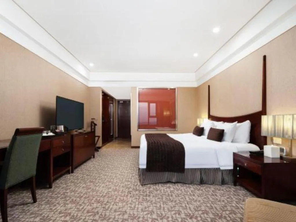 Bed in Grand New Century Hotel Binhai Tianjin