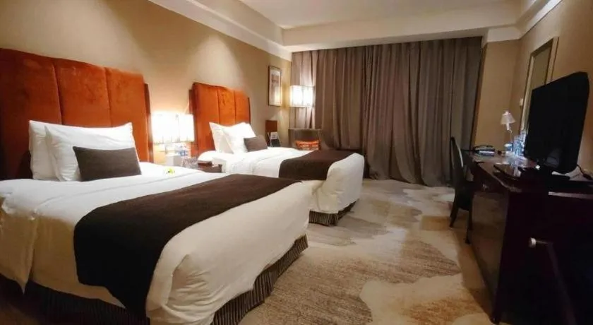 Bed in Grand New Century Hotel Binhai Tianjin