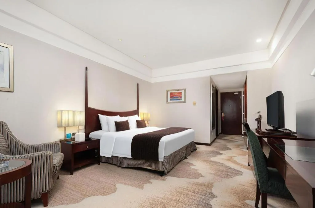 Bed in Grand New Century Hotel Binhai Tianjin