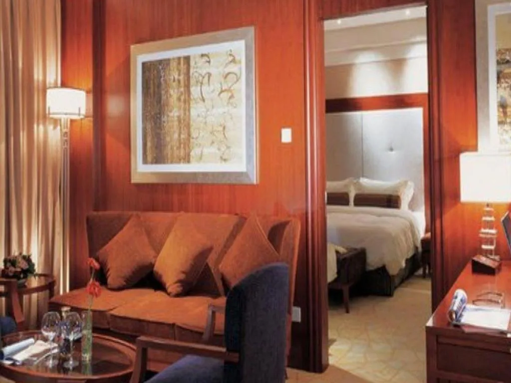 Bed in Grand New Century Hotel Binhai Tianjin