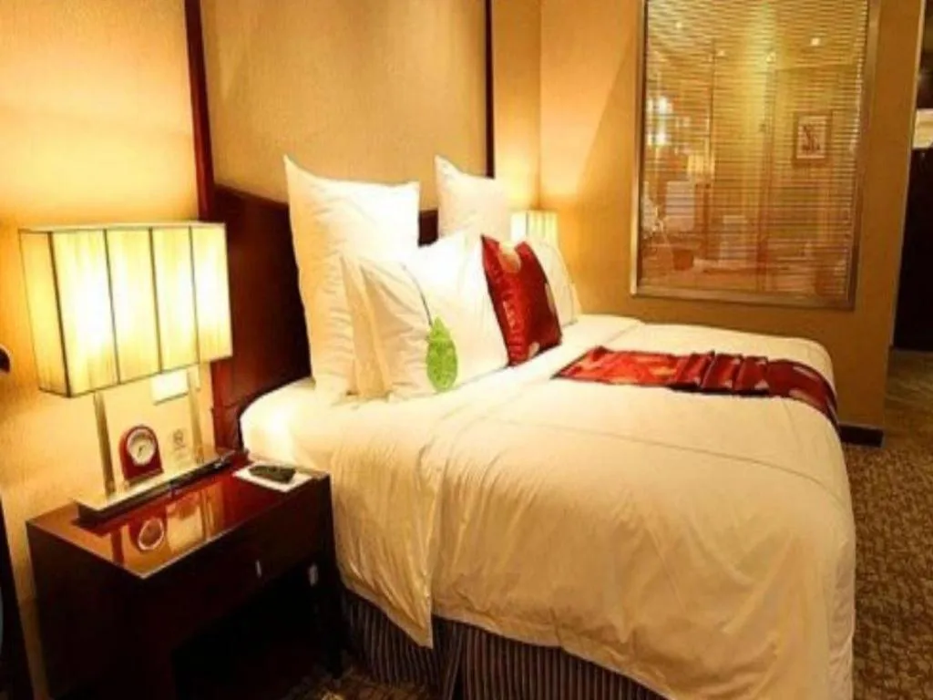 Bed in Grand New Century Hotel Binhai Tianjin