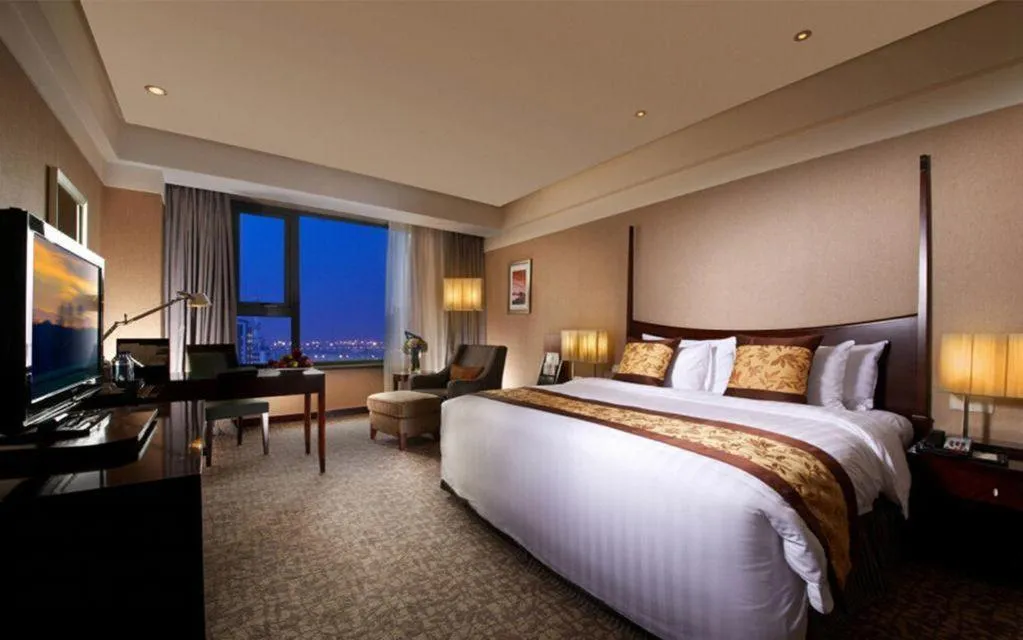 Bed in Grand New Century Hotel Binhai Tianjin