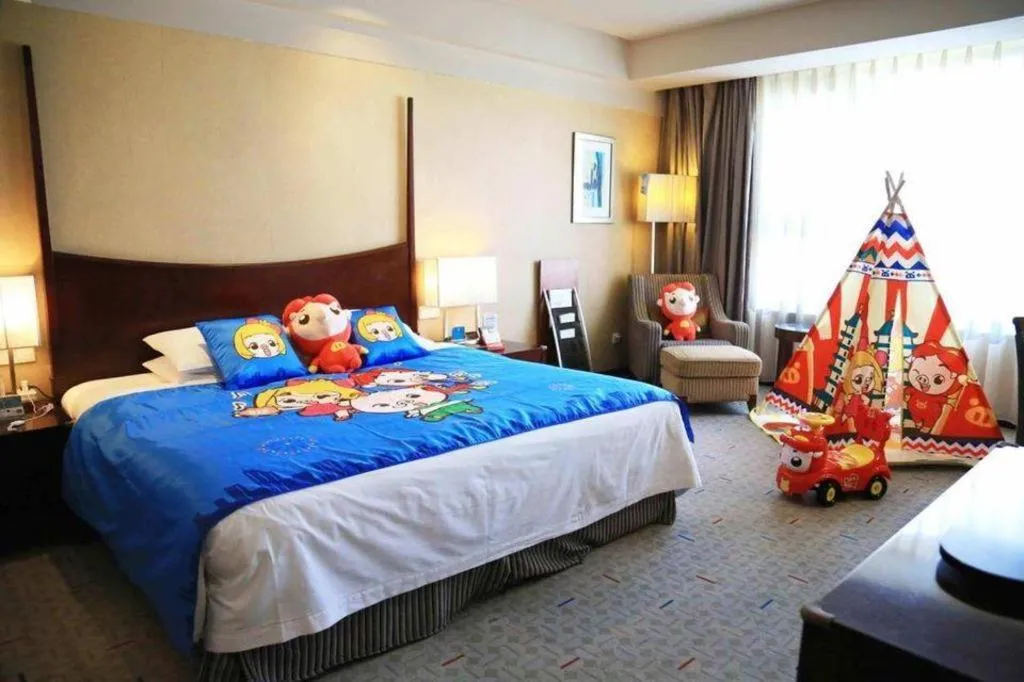 Bed in Grand New Century Hotel Binhai Tianjin