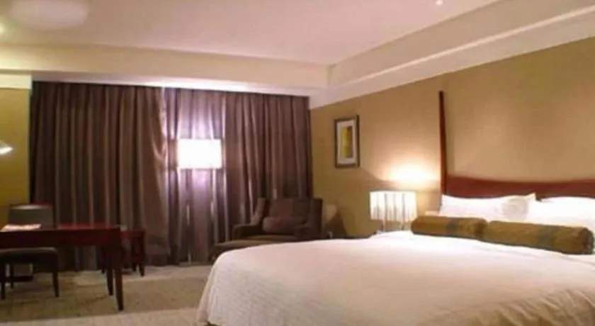 Bed in Grand New Century Hotel Binhai Tianjin