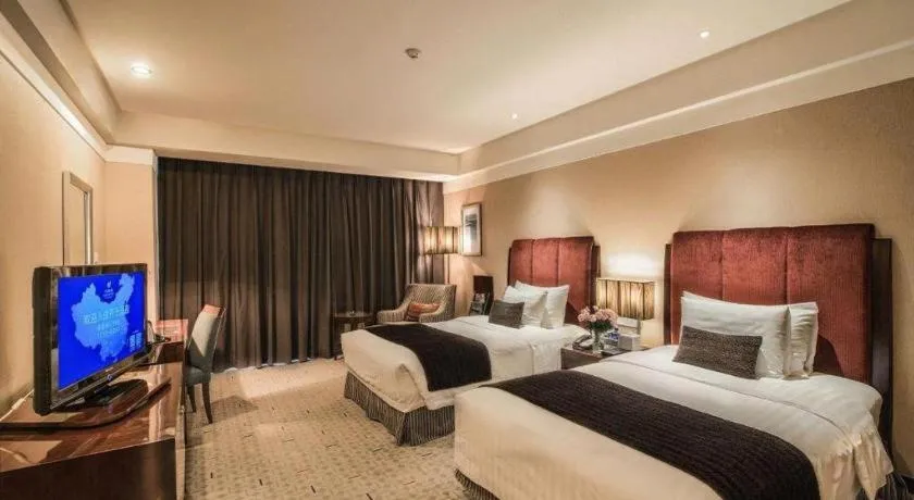 Bed in Grand New Century Hotel Binhai Tianjin