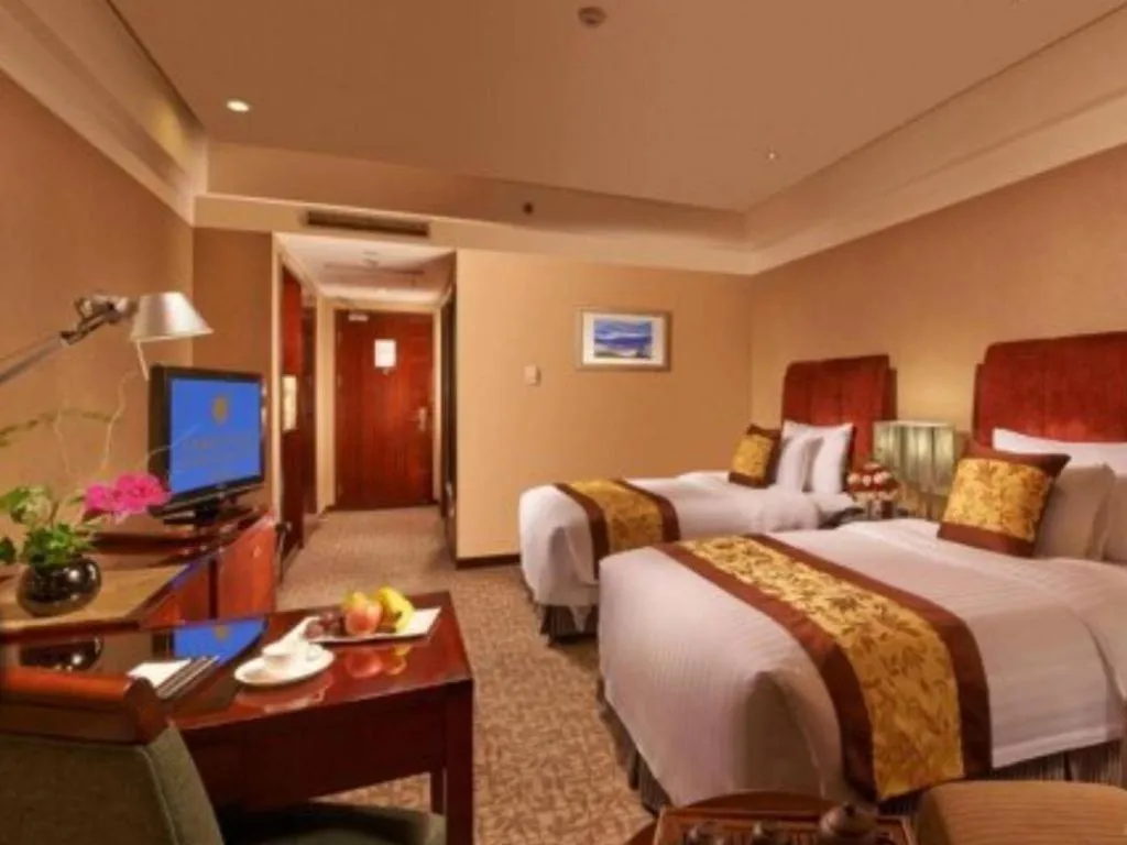 Bed in Grand New Century Hotel Binhai Tianjin