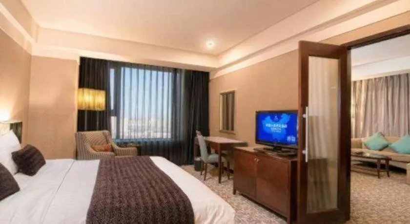 Bed in Grand New Century Hotel Binhai Tianjin