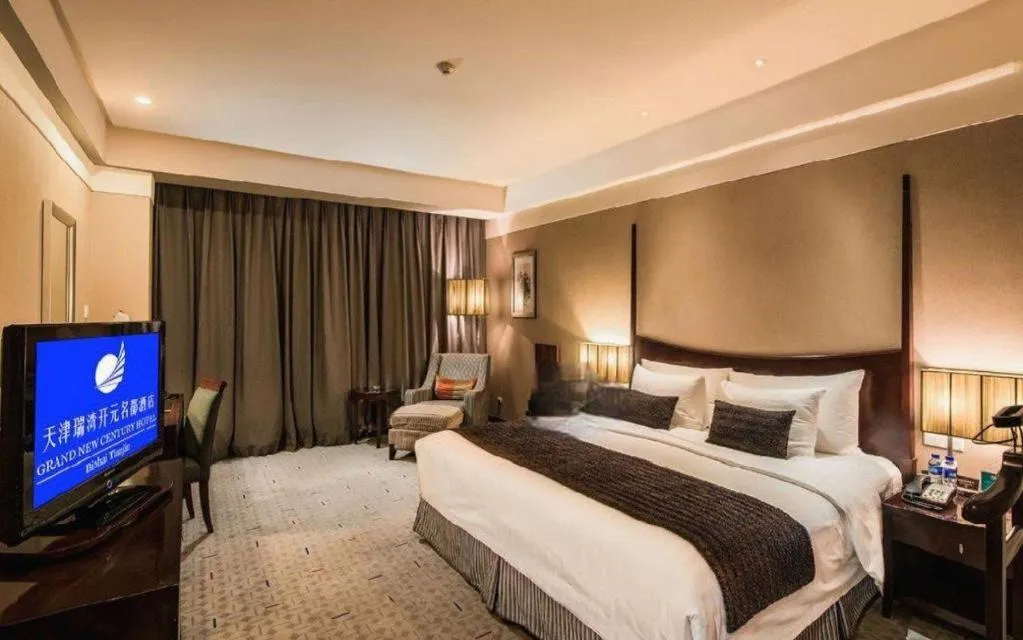 Bed in Grand New Century Hotel Binhai Tianjin