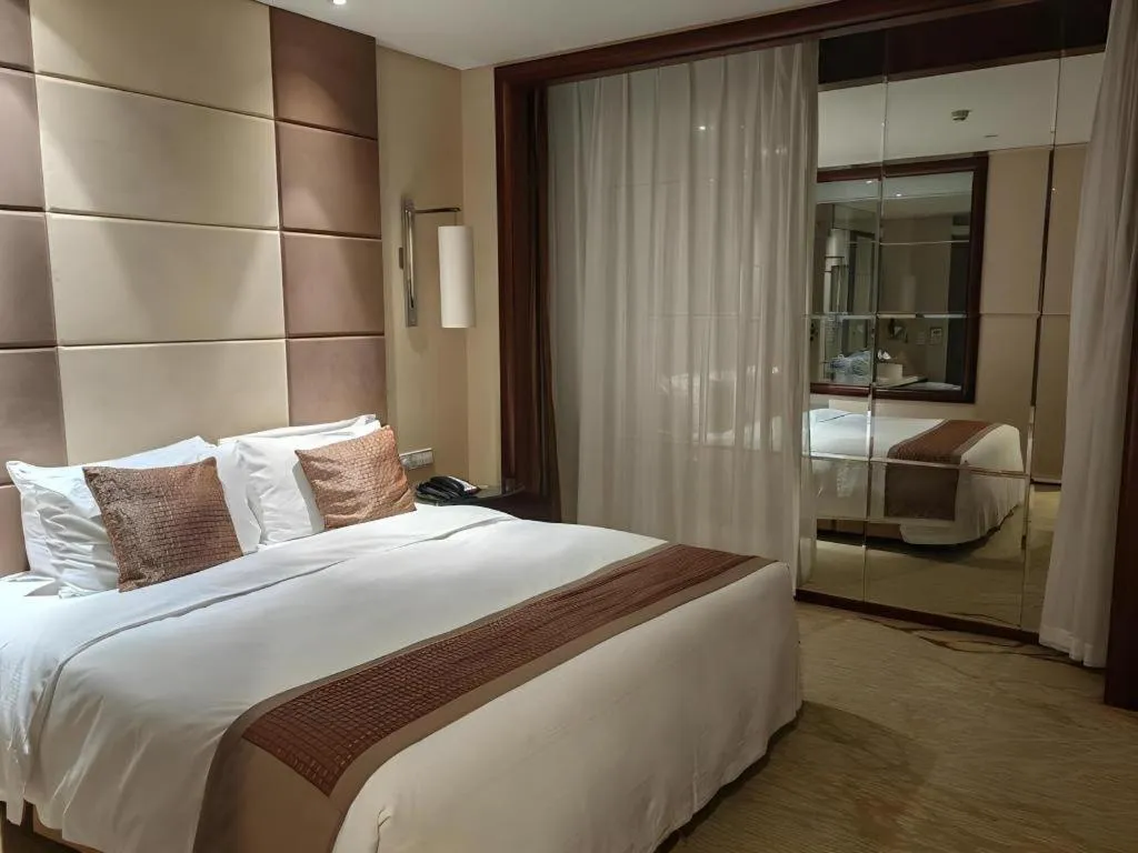 Bed in Beijing Liaoning Hotel