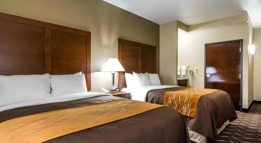 Bed in AmericInn by Wyndham Memphis East