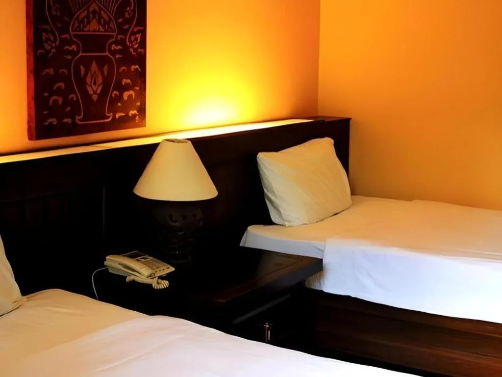 Bed in PhoomThai Garden Hotel