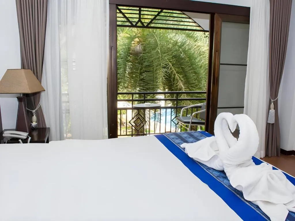 Bed in PhoomThai Garden Hotel